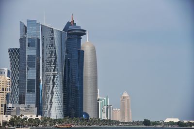 Modern buildings in city against sky