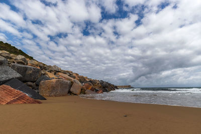 Scenic view of beach against sky