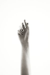Close-up of human hand against white background