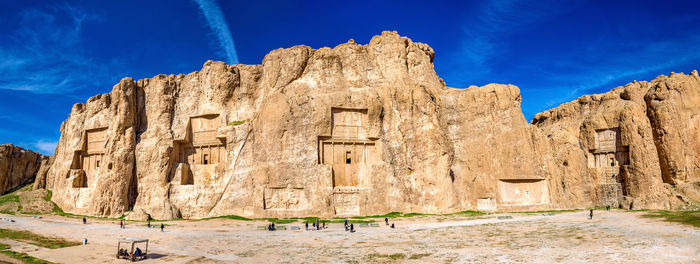 Low angle view of old ruins against blue sky