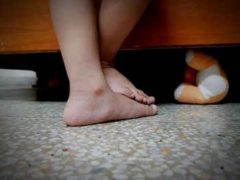 Low section of child standing on floor