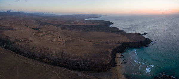 High angle view of sea against sky during sunset
