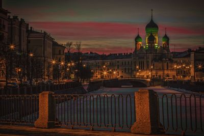 View of illuminated city at sunset