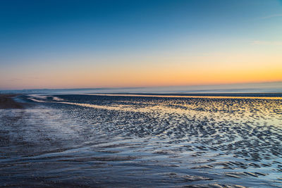 Serene low tide at sunrise