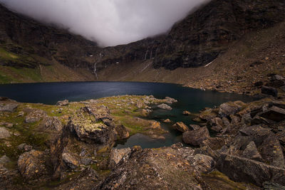 Scenic view of river against mountains