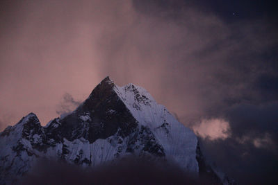 Scenic view of snowcapped mountains against sky during winter