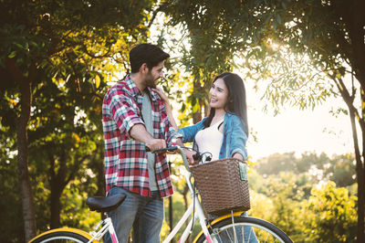 Friends riding bicycle