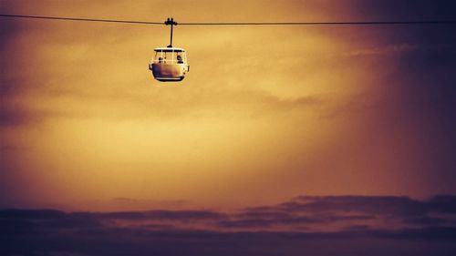 Overhead cable car against sky