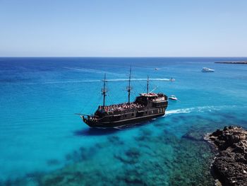 Boat on sea against clear sky