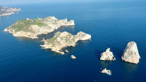 High angle view of rock formations in sea