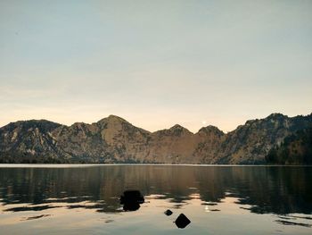 Scenic view of lake against sky during sunset in segara anak mt.rinhani.