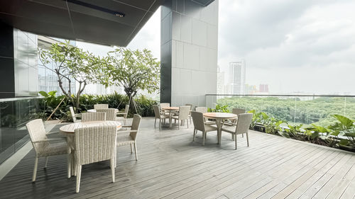 Empty chairs and tables in restaurant
