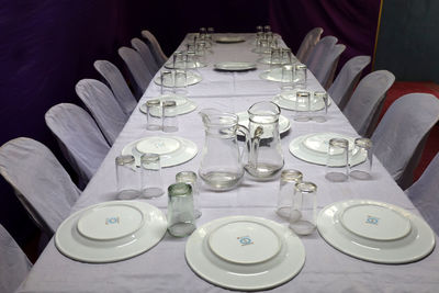 High angle view of glasses on table in restaurant