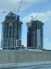 Low angle view of buildings against sky in city