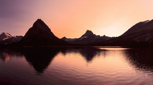 Scenic view of lake against sky during sunset