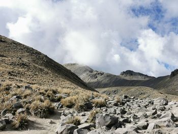 Scenic view of arid landscape against sky