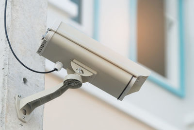 Close-up of security camera on building