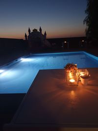 View of swimming pool at night