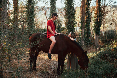 Full length of woman in forest