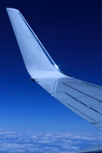 Low angle view of airplane flying in sky