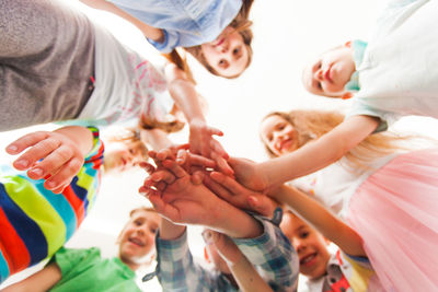 High angle view of people with hands