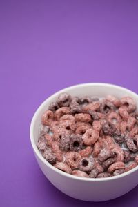 Close-up of pink bowl against blue background