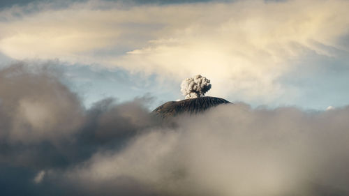 Steam emitting from volcanic mountain