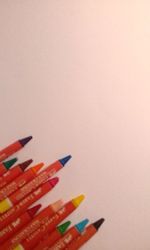 Close-up of multi colored pencils over white background