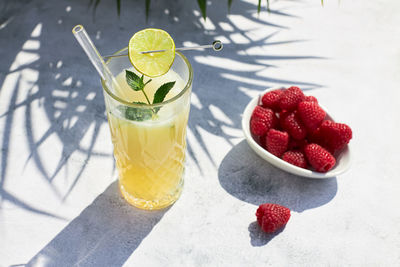 Close-up of strawberries in glass on table