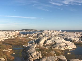 Aerial view of rocks on land against sky