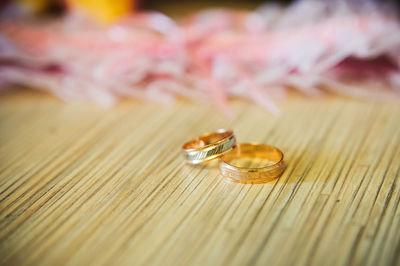 Close-up of wedding rings on table