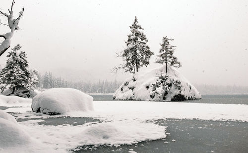 Winter landscape, frozen lake, trees, snow, outdoors.