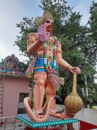 Low angle view of statue against sky