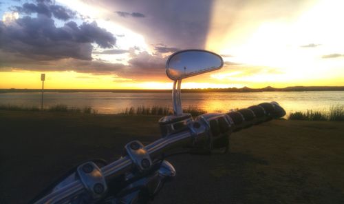 Scenic view of calm lake at sunset