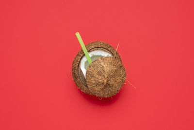 High angle view of strawberry against red background