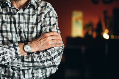 Midsection of man wearing mask