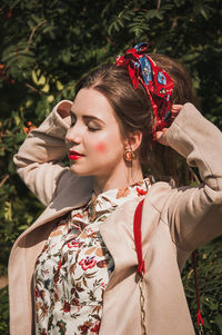 Young woman standing in park