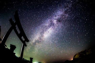 Low angle view of star field against sky