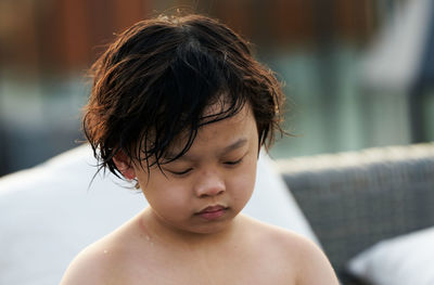 Close-up portrait of shirtless boy