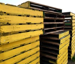 Stack of wooden palettes in warehouse