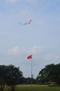 Low angle view of kite flying against sky