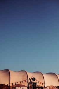 Scenic view of desert against clear blue sky