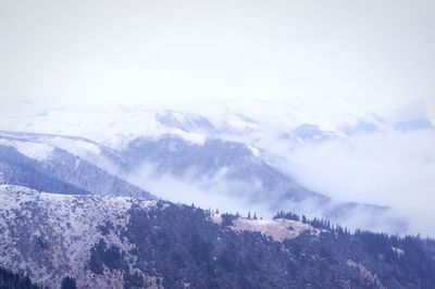 Scenic view of mountains against sky during winter