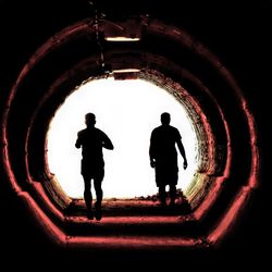 Silhouette men in corridor