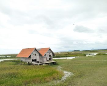 House on field against sky