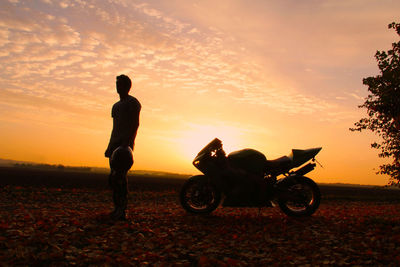 People on landscape at sunset