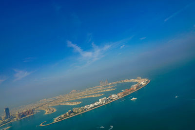 Aerial view of sea against cloudy sky