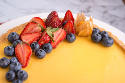 Close-up of strawberries in plate on table