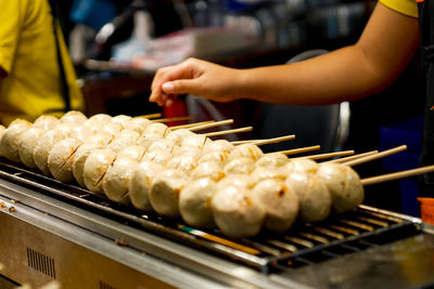 Midsection of woman preparing food