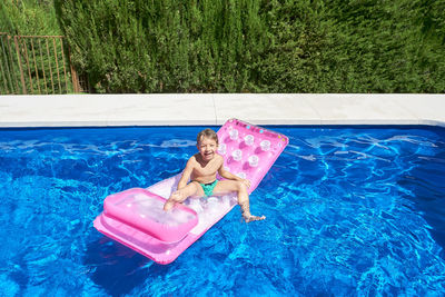 Young man in swimming pool